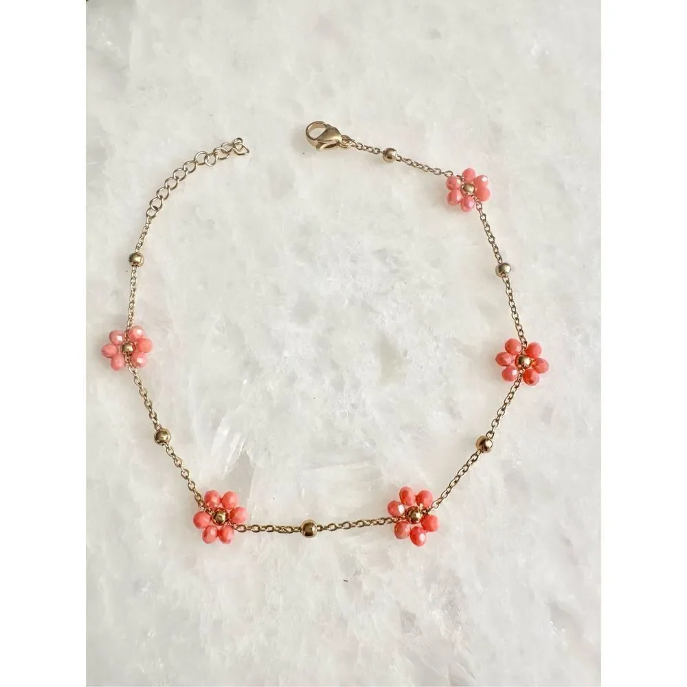 Delicate sparkly orange beaded flower chain bracelet
